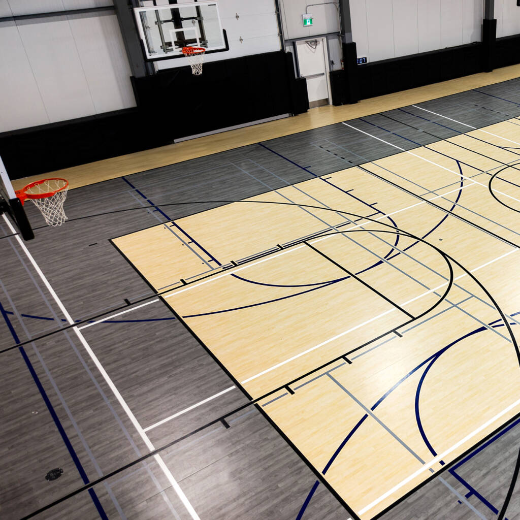 Synthetic vinyl flooring in an athletic facility