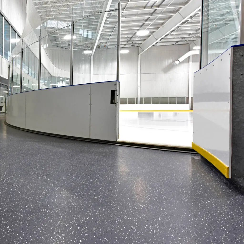 Ice rink access with skate-resistant rubber flooring
