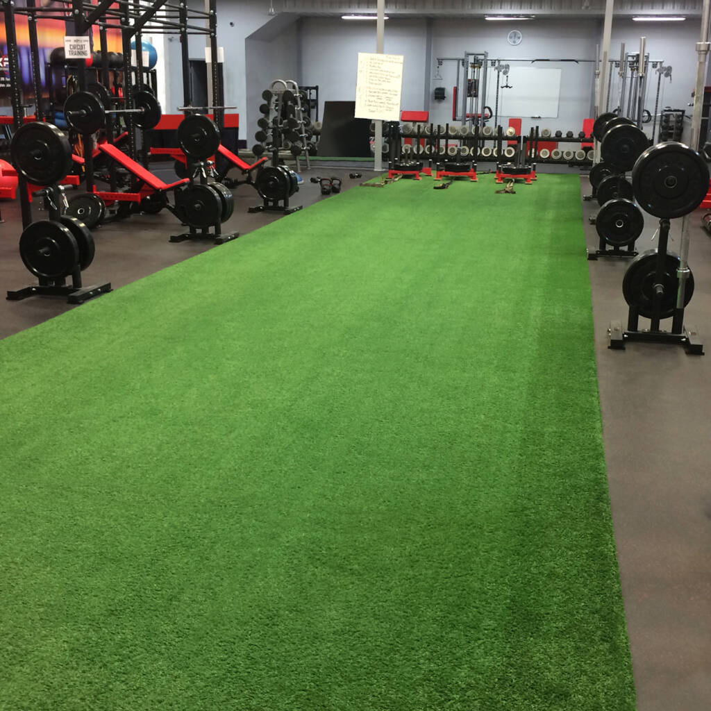 Synthetic turf track in a fitness center