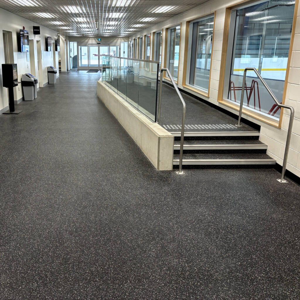 Rubber flooring with viewing platform in ice arena