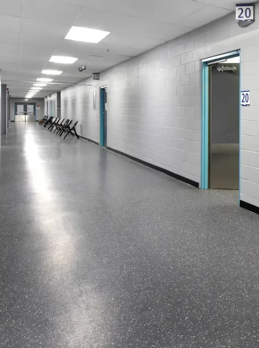 Skate-resistant rubber flooring in an arena ice rink corridor